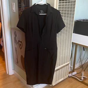 Black nurse/waitress dress. Built in front pockets.